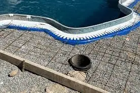 Preparing for the concrete pour for a fiberglass pool