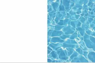 Clear blue swimming pool water with sunlight reflections.