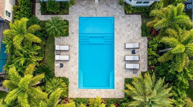 Radiant Island rectangle fiberglass pool by Rainforest Pools